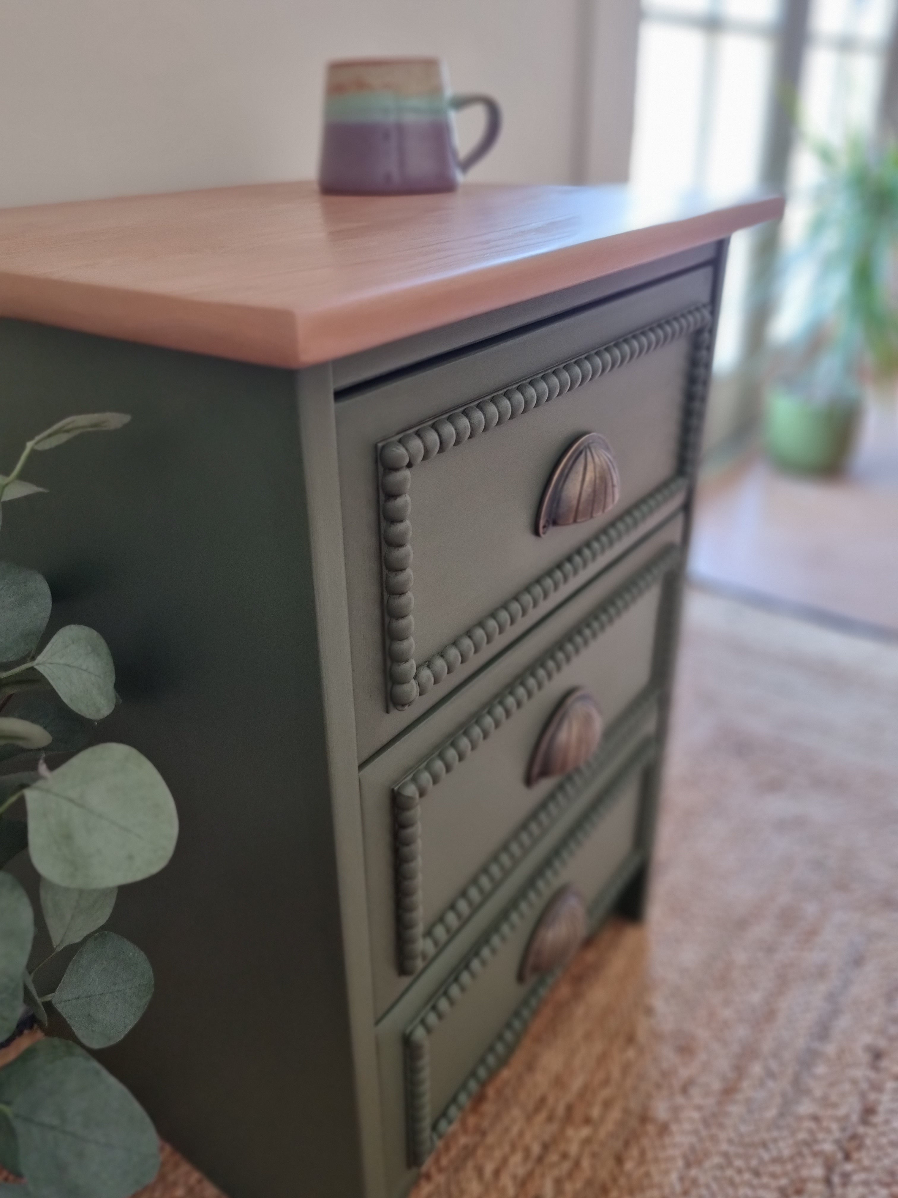 Green bobbin drawers with bronze cup handles