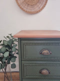 Green bobbin drawers with bronze cup handles